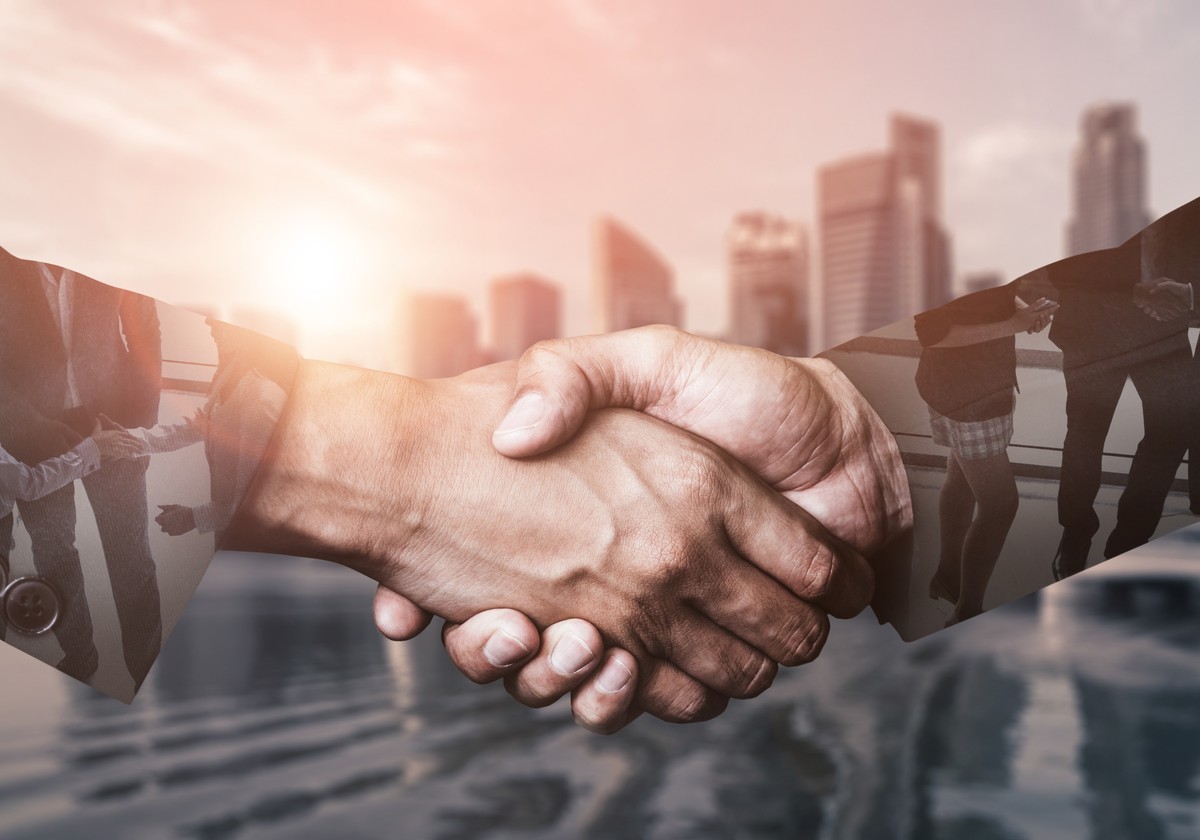 a successor shaking hands with his manager