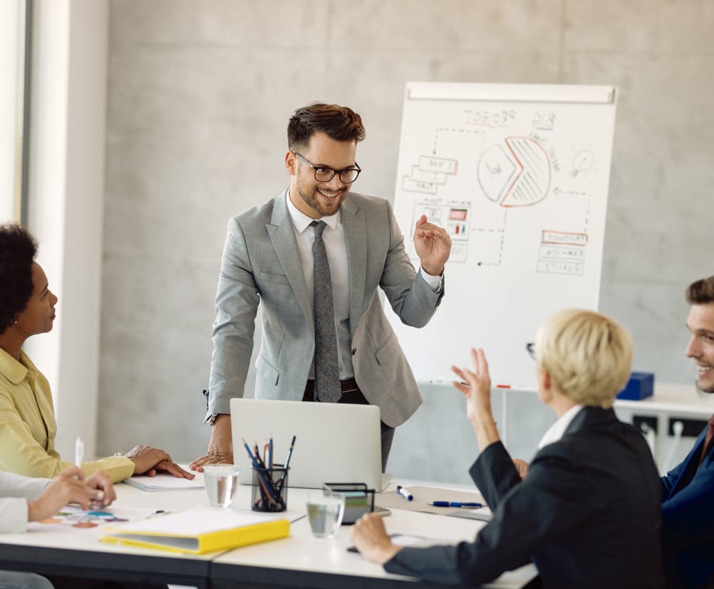 delivering a leadership training to a group of managers